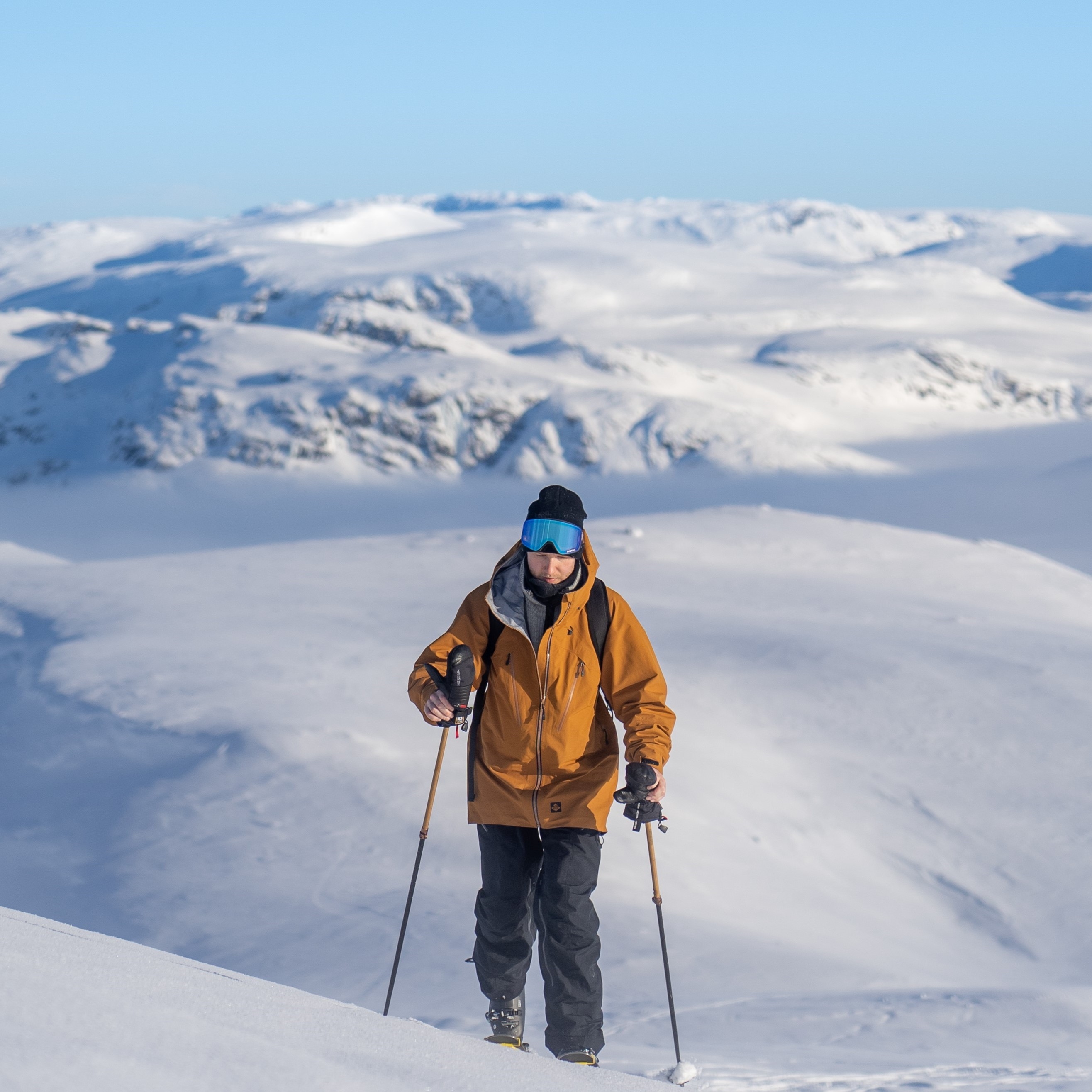 A guy doing some back country skiing in beautiful winter landscapes in Voss